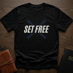 A Black Christian streetwear shirt with freedom message 'Set Free'. Faith based graphic tee inspired by John 8:36 Bible verse. Modern faith based shirt symbolizing freedom through Christ. Perfect for church and everyday wear. Made by Eternal Thread Apparel, a Christian apparel brand. Available in one other color.