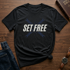 A Vintage Black Christian streetwear shirt with freedom message 'Set Free'. Faith based graphic tee inspired by John 8:36 Bible verse. Modern faith based shirt symbolizing freedom through Christ. Perfect for church and everyday wear. Made by Eternal Thread Apparel, a Christian apparel brand. Available in one other color.