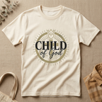 Soft Cream Bella + Canvas 3001 Modern Christian t-shirt featuring a “Child of God” faith-based graphic design with crown, heart, and cross elements in a minimalist vintage style.