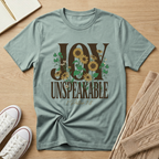 Christian sunflower shirt displaying Joy Unspeakable and 1 Peter 1:8 scripture on Bella Canvas 3001 Dusty Blue faith-based apparel.