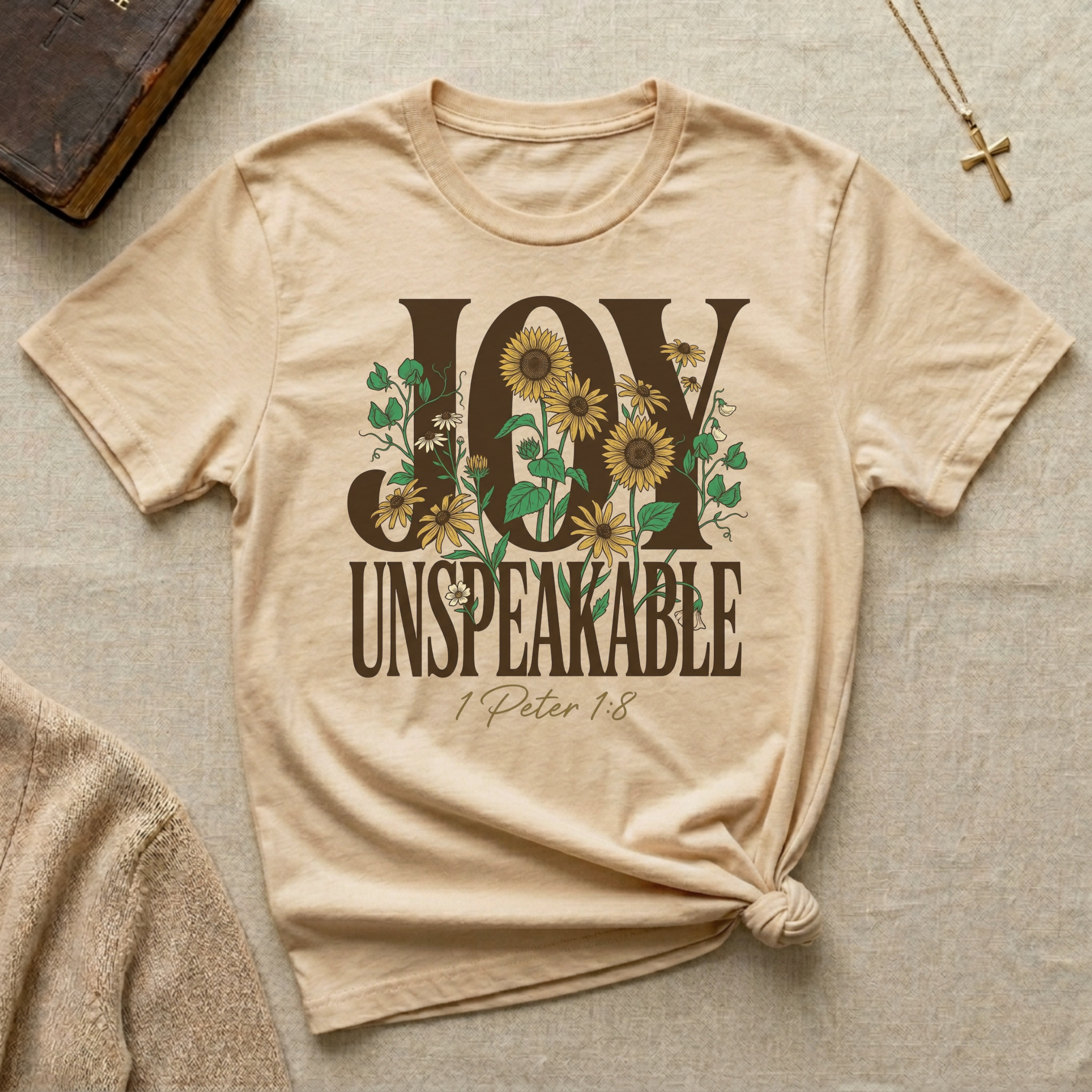 Christian sunflower shirt displaying Joy Unspeakable and 1 Peter 1:8 scripture on Bella Canvas 3001 Soft Cream faith-based apparel.